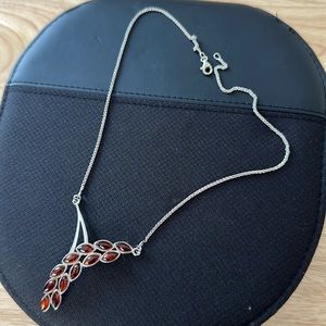 Silver necklace with amber stones